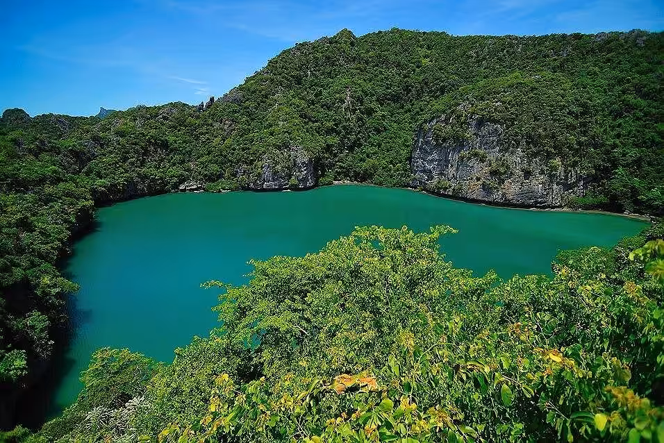 Emerald Lake hidden saltwater lagoon surrounded by limestone cliffs Mae Ko Island Ang Thong Marine Park