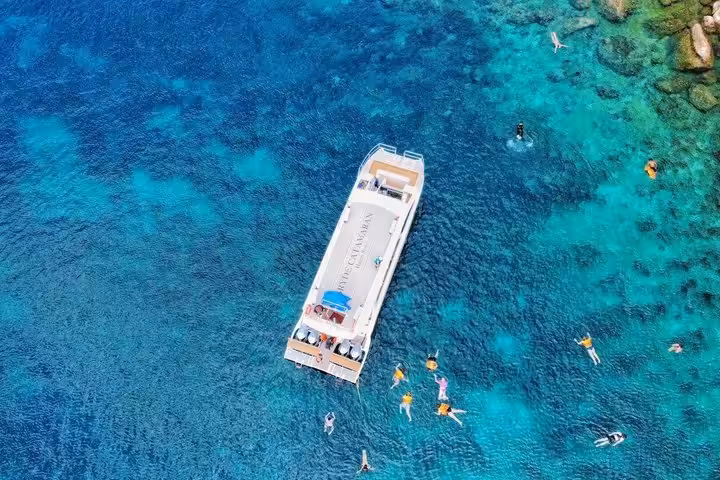 Premium catamaran cruising through Ang Thong Marine Park limestone islands from Koh Samui