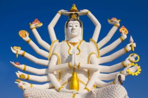 Sacred 18-armed Guanyin Buddha statue with golden details at Buddhist temple, Koh Samui